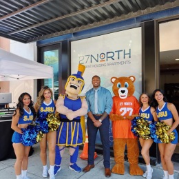 people and a mascott